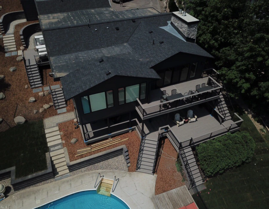 aerial view of two storey house with beautiful decks prior lake mn